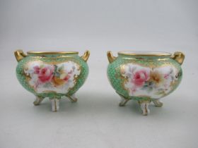 A pair of  Royal Worcester Graingers vases, having  panels decorated with flowers to a scale green