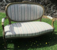 A French style gilt wood salon settee, with carved decoration