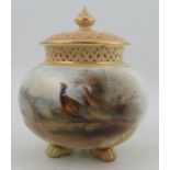 A Royal Worcester covered pot pourri, decorated with pheasants in landscape by James Stinton, with