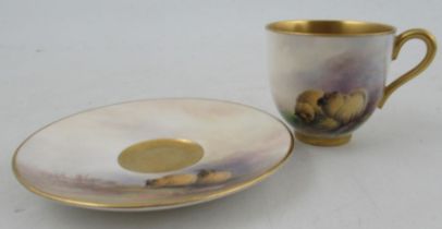 A Royal Worcester miniature coffee cup and saucer, both the cup and saucer decorated with sheep in