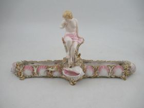 A Royal Worcester centre piece, decorated with a semi clad lady, the base decorated with shells,