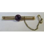 A yellow gold triple bar brooch, set with a stone, weight 3.5g