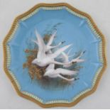 A Royal Worcester cabinet plate, decorated with five swans to a blue ground by CHC Baldwyn, with