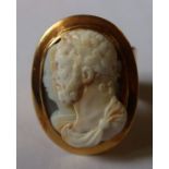 A gold cameo shell ring, with carved double bust portrait of Roman Emperor and female, in polished