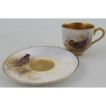 A Royal Worcester miniature coffee cup and saucer, cup decorated with a wood Cock, saucer