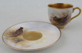 A Royal Worcester miniature coffee cup and saucer, cup decorated with a wood Cock, saucer