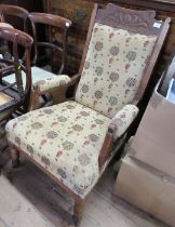 An Edwardian show wood armchair, with carved decoration