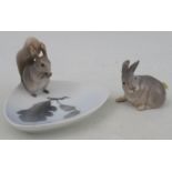 A Royal Copenhagen model, of a rabbit, No 1252/1691, c1935, together with a dish with a squirrel, No