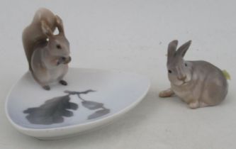 A Royal Copenhagen model, of a rabbit, No 1252/1691, c1935, together with a dish with a squirrel, No