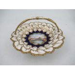 A Chamberlain and Co. Worcester card tray/ basket, having a central panel decorated with a view of