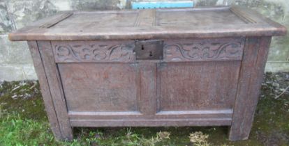 A small 18th century oak coffer, with plain raising lid and floral frieze  (133)