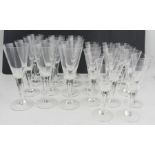 A set of 11 Dartington wine glasses, height 9ins, together with a set of 14 smaller Dartington