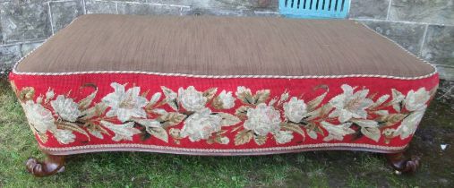 An ornate 19th century serpentine shaped salon stool raised on knurl feet and with needlework