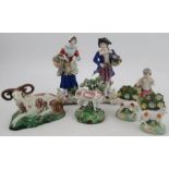 A pair of Continental porcelain models, height 9ins, together with another 19th century figure and