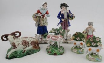 A pair of Continental porcelain models, height 9ins, together with another 19th century figure and