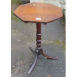 An oak octagonal topped occasional table, diameter 17ins, height 28ins