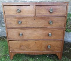 A Georgian mahogany chest, of two short drawers over three graduated long drawers raised on