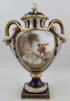 A Royal Worcester ornate two handled covered pedestal vase, decorated to the front with two seated