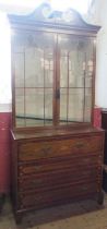 A Regency mahogany and inlaid secretaire bookcase, with inlaid decoration, the upper glazed