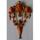 A 19th century Italian carved coral and gold pendant brooch, having oval carved coral bust portrait,