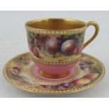 A Royal Worcester miniature coffee cup and saucer, decorated with a band of fruit to a mossy