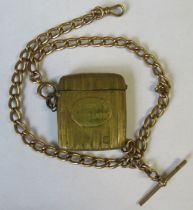 A 9ct yellow gold oval link watch chain, suspending a gilt metal vesta, case stamped 'Dewar's