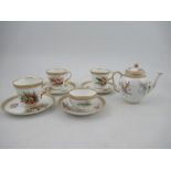 Four assorted Royal Worcester tea cups and saucers, with jeweled decoration and decorated with