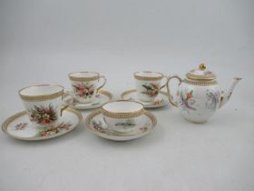 Four assorted Royal Worcester tea cups and saucers, with jeweled decoration and decorated with