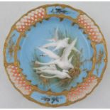 A Royal Worcester comport, decorated with five swans to a blue ground by CHC Baldwyn, the border