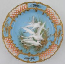 A Royal Worcester comport, decorated with five swans to a blue ground by CHC Baldwyn, the border