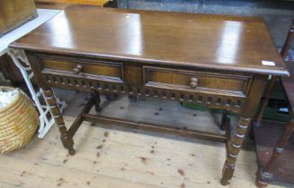 An oak hall table, fitted with two drawers, width 42ins, depth 19.5ins, height 20ins