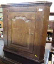 An Antique oak corner cupboard, width 26.5ins, height 26ins, depth 14.5ins