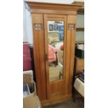 A satinwood single door wardrobe/hall cupboard, with mirror door and pierced glazed panels, width