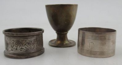 Two hallmarked sliver napkin rings, together with a hallmarked silver egg cup, weight 2oz