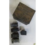 Four vintage metal number printing blocks, together with a printing block with crest and a metal