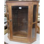 A Cotswold style glazed corner cupboard, width 25ins, height 29.5ins, depth 14ins