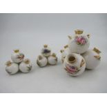 A Royal Worcester four piece globular vase, decorated with flowers, height 6ins, width 6ins together