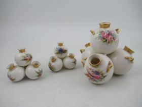 A Royal Worcester four piece globular vase, decorated with flowers, height 6ins, width 6ins together