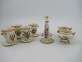 Four Royal Worcester vases, decorated with hand painted flowers and having jewelled decoration,