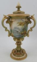 A Royal Worcester after Hadley covered vase, having three handles, decorated with panels of storks