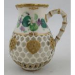 A Kerr & Binns Worcester reticulated jug, decorated with painted flowers and a bird, height 4ins