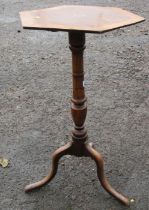 A 19th century walnut and yew wood octagonal topped tripod table, with inlaid and crossband