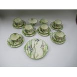 A Royal Doulton Art Nouveau tea service, comprising six cups, saucers, side plates, sugar bowl and