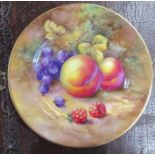 A Royal Worcester plate, decorated with fruit to a mossy background by H Price, diameter 4.25ins