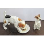 Two Royal Doulton models, of terriers, one licking a plate