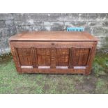An oak coffer having fielded panels to the front and sides  width 41.5ins, depth 21ins, height 21ins