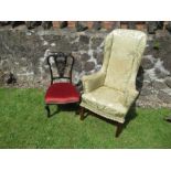 A wing back arm chair together with an Edwardian bedroom chair