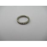 A white precious metal (probably plat) diamond Eternity ring, set with twenty two round brilliant