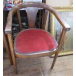An Edwardian beech chair with upholstered seat