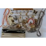 Three various coral necklaces, a quantity of gilt costume jewellery, paste set jewellery
